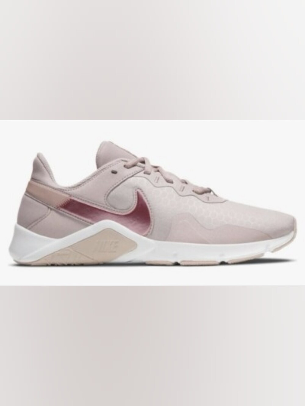Nike Women’s Pale PinkAthletic Sneakers with Pink-Purple Swoosh